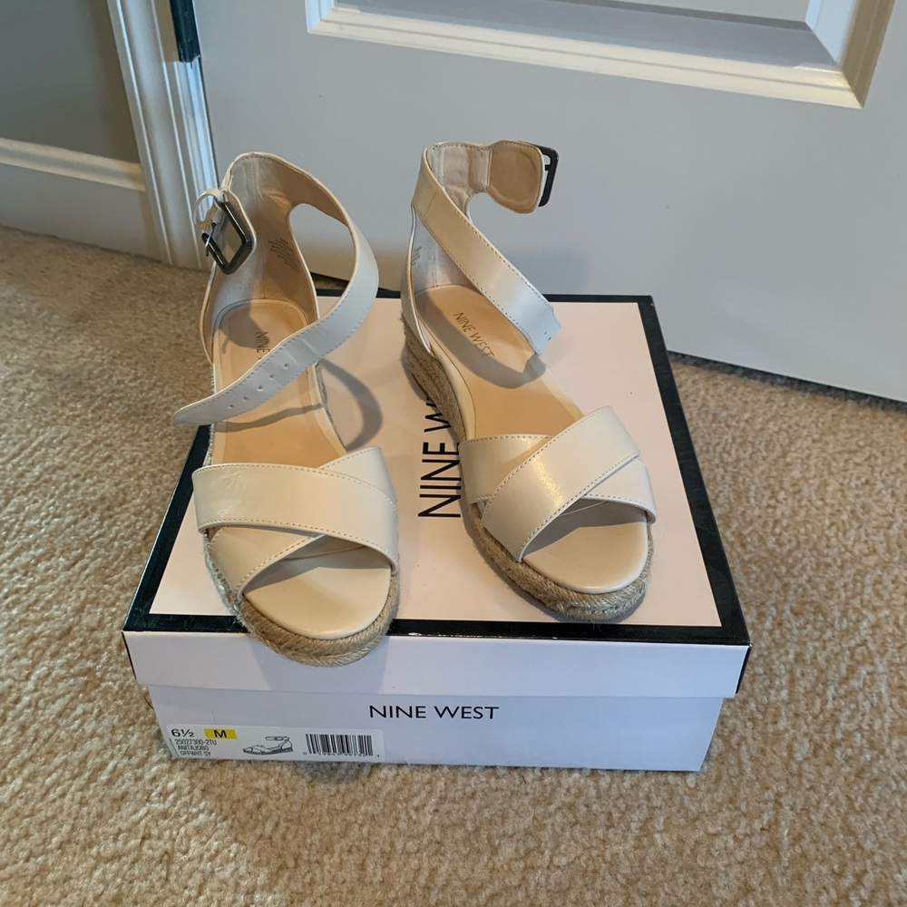 Women’s Nine West size 6.5 cream platform sandal.